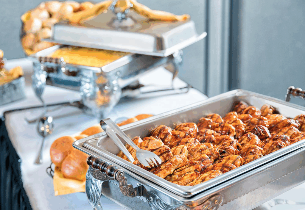 A shot of calhouns bbq chicken breasts (a knoxville favorite) in a catering tray, ready to be served.